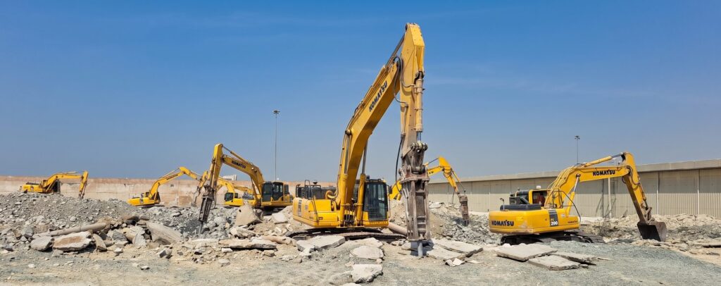 Komatsu excavators working on demolition rubble in Dubai