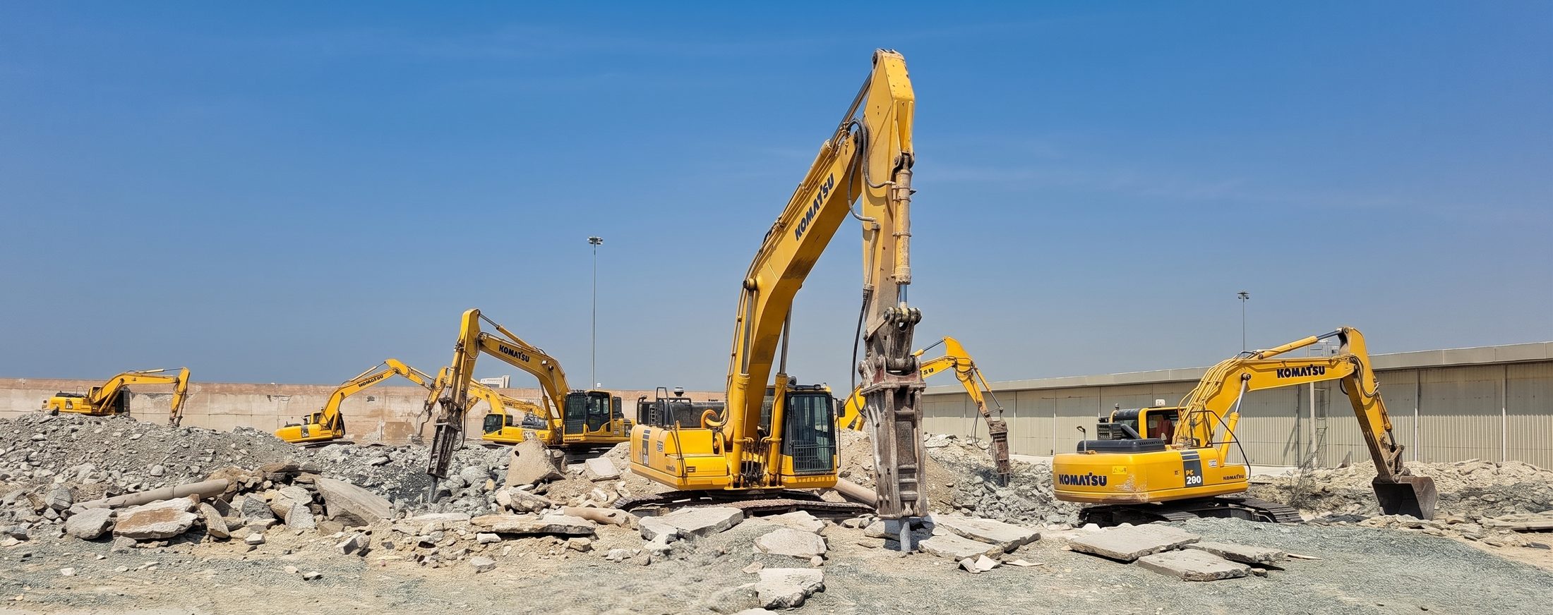 Komatsu excavators working on demolition rubble in Dubai